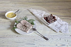 Sliced veal tongue on a white plate