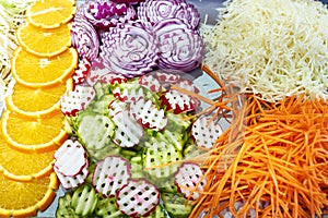 Sliced vegetables for salad in kitchen