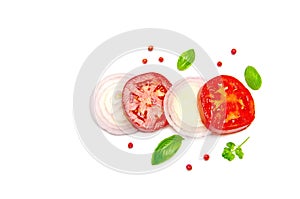 Sliced vegetables tomato and onion and Basil leaves and pepper peas parsley on white background