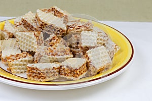 Sliced waffle layered cakes with caramel filling close-up