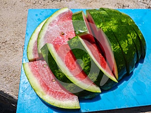 Sliced watermelon on a cutting board