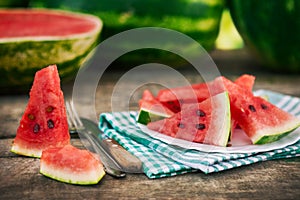 Sliced watermelon on table and plate