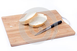 Sliced white bread and knife on the cutting board