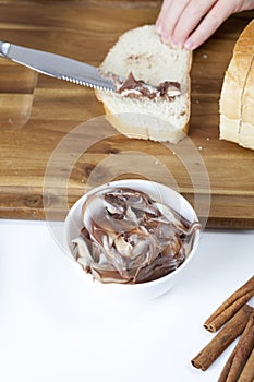 sliced white bread with smeared chocolate butter