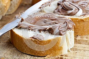 sliced white bread with sweet chocolate butter spread