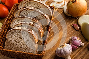 Sliced white bread with wheat flour on a wooden table. Chamado PÃ£o de forma