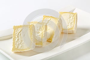 Sliced white rind cheese