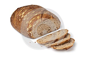 Sliced whole fresh baked German dinkel wheat bread on white background