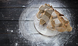 Sliced whole grain bread on a rustic wooden table