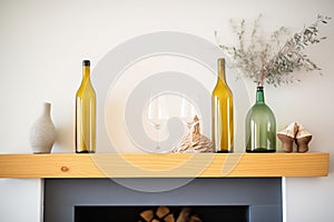 sliced wine bottle candle holders on a mantelpiece