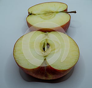 sliced ??yellow apple fruit with visible seeds and insides