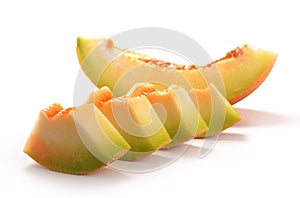 Sliced yellow honeydew melon isolated on white background