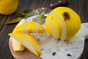 Sliced yellow quince or queen apple autumn fruits with seeds