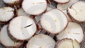 Sliced yucca root. Raw manioc slices. Dried cassava plant. Macro.