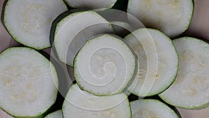 Sliced zucchini courgette vegetables. turntable closeup shot.
