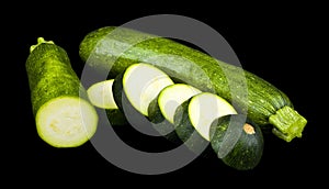 Sliced zucchini isolated on a black background