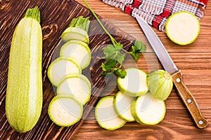 Sliced zucchini on a wooden table. Top View