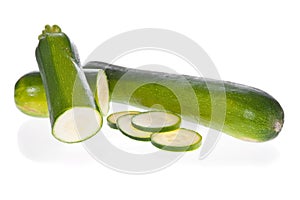 Sliced zucchinis or courgettes isolated on white