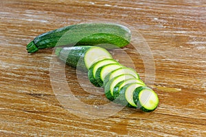 Sliced zuccini on wooden background