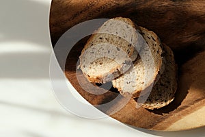 sliced â€‹â€‹french bread on wood plate