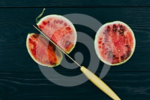 Sliced â€‹â€‹little fresh watermelon on a dark background. Summer fruit