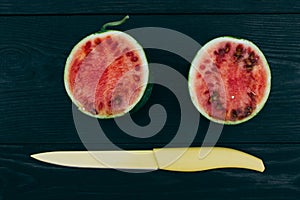 Sliced â€‹â€‹little fresh watermelon on a dark background. Summer fruit