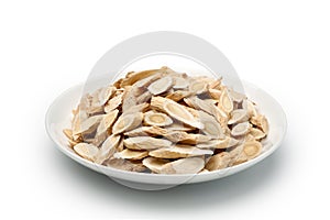 sliced â€‹â€‹of Astragalus (Huang Qi) in a ceramic dish