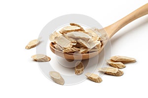 sliced â€‹â€‹of Astragalus & x28;Huang Qi& x29; in a wooden spoon