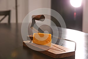 Slicer and piece of cheese