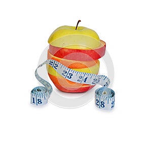 Slices of apples and orange with measuring ruler