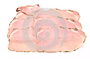 Slices of Arista on white background. It is a traditional roast pork loin of the Tuscany cuisine