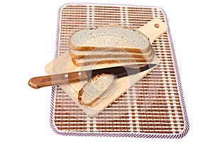 Slices of bread knife chopping board isolated