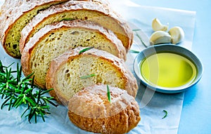 Slices of bread with rosemary, garlic and olive oil.