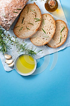 Slices of bread with rosemary, garlic and olive oil. photo