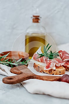 Slices of bread with spanish serrano ham photo
