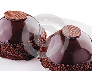 slices of cake in chocolate icing isolated on white
