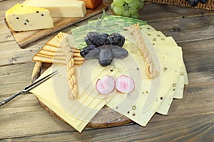 Slices of cheese with grapes