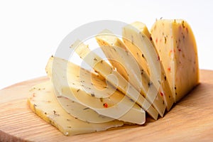 Slices of cheese with spices