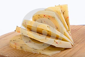 Slices of cheese with spices