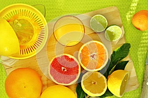 Slices of citrus fruit and a fresh juice