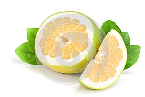 Slices of Citrus Sweetie or Pomelit, oroblanco with leaf isolated on white background close-up