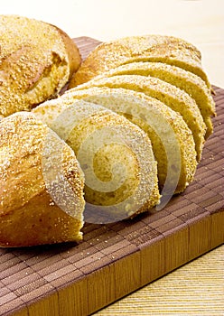Slices corn bread on wood board
