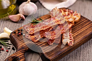 Slices of crispy hot fried bacon