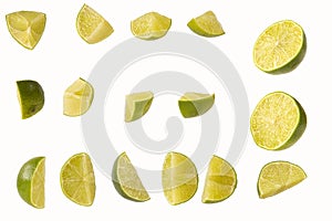 Slices of cut lime isolated on white background
