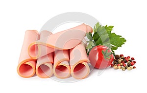 Slices of delicious boiled sausage with parsley, tomato and pepper on white background