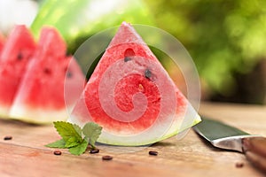 Slices of delicious watermelon on the table outdoors