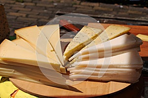 Slices of different cheese to taste on a market in Netherlands