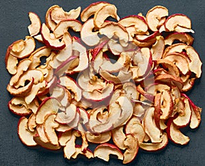Slices of dried red apples close-up, healthy and dietary nutrition