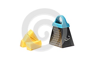 Slices of Edam cheese and fine grater isolated on white background