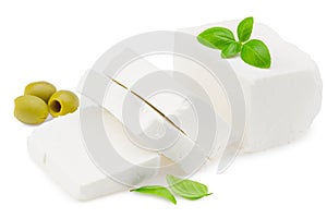 Slices feta cheese with olives and basil isolated on white background. Clipping path and full depth of field
